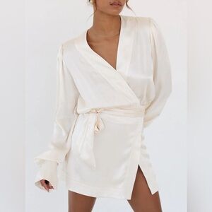 Rumored - Wrap mini dress with padded shoulders.